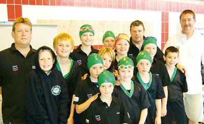 Head coach John Amos with part of the Tenby team at the Amman Valley Sprints.