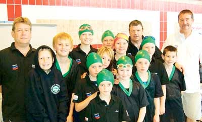 Head coach John Amos with part of the Tenby team at the Amman Valley Sprints.