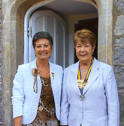 Joyce Walker (left) with new president Pat Mathews.