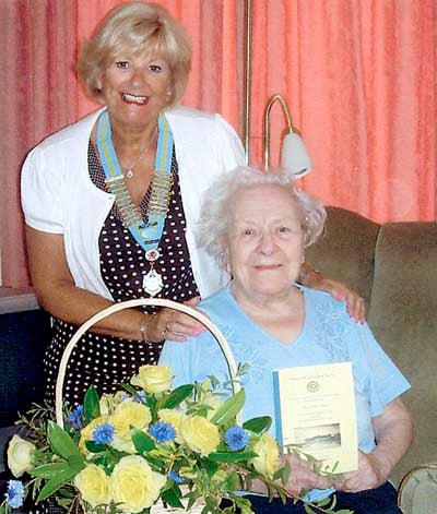 Lillian received a basket of flowers from district chairman Toni.