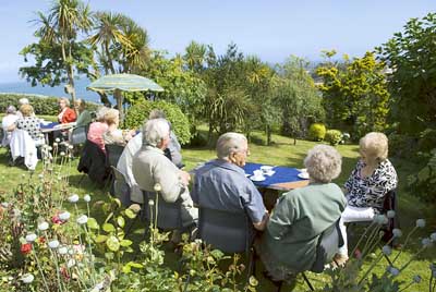Some of the guests enjoying the beautiful gardens at the home of Mr. and Mrs. Graham Hughes, Fairfield, Northcliffe, Tenby.