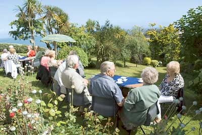 Some of the guests enjoying the beautiful gardens at the home of Mr. and Mrs. Graham Hughes, Fairfield, Northcliffe, Tenby.