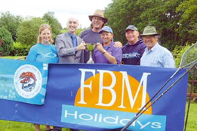 Coarse fishing champion Clive Wright (third from right) is pictured receiving the cup from David Harries of FBM Holidays. With them is runner-up John Charlesworth (second from right) and Graeme Block who was third (centre). Also pictured is Jo Welch (Pembrokeshire County Council’s assistant food officer) and Ian Heaps, of Holgan Farm.