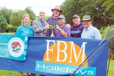Coarse fishing champion Clive Wright (third from right) is pictured receiving the cup from David Harries of FBM Holidays. With them is runner-up John Charlesworth (second from right) and Graeme Block who was third (centre). Also pictured is Jo Welch (Pembrokeshire County Council’s assistant food officer) and Ian Heaps, of Holgan Farm.