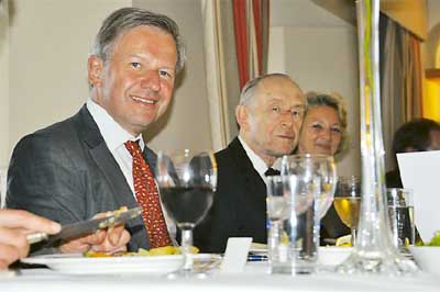 Pictured from the left are Sir Sherard, Peter, and Lady Bridget Cowper-Coles at the celebration dinner in the Fourcroft Hotel.