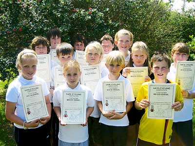 Year 5 with the certificates they received after completing a safe cycling course.