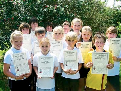 Year 5 with the certificates they received after completing a safe cycling course.