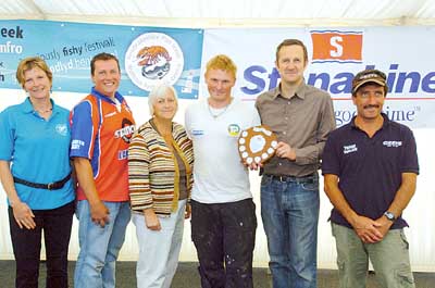 Sea angling champion Adrian Tucker from Milford Haven (centre) is presented with his trophy by Stena Line’s route manager, Ian Davies. With them is runner-up Francos Attanasio (far right) and Dave Harries (second from left) who finished third. Also in the picture is Fish Week organiser and Pembrokeshire County Council food officer, Kate Morgan (far left) and county council cabinet member for health and well-being, Sian James