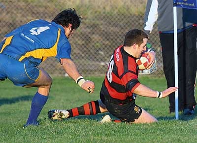 Jimmy Davies slides in for the match-winning try. Pic. Susan McKehon