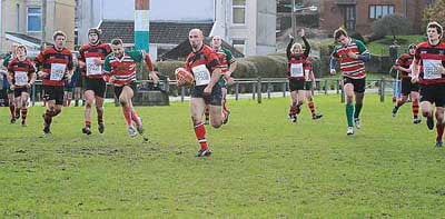 His team-mates celebrate behind him as Mark Heywood races in for one of his three tries. Pic. David Bolton