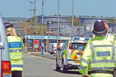 Police outside the refinery after the blast. Pic Martin Cavaney Photography