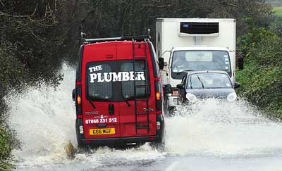 Even local plumber Martin Gilpin wasn’t used to dealing with this much water as he’s pictured travelling along the road between St. Florence and Sageston during Monday’s floods. Pic. Gareth Davies Photography