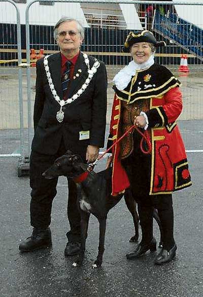 Mayor of Pembroke Dock, Clr. Andrew McNaughton, and Pembroke Town Crier, Clr. Mrs. Rose Blackburn, await the disembarkation of the cruise ship passengers.