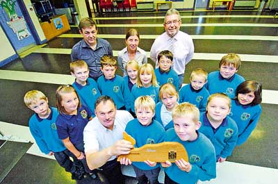 Pictured is Clr. George presenting the Bronze Sustainable Schools Award to Golden Grove Community School with teacher Rhian Bruce, headteacher Leslie Johnson and caretaker Jason Robinson. The pupils, all Eco Club members, are Rhys Griffiths, Mair Tyrie, Toby Bowen, Ben Omnet, Holly Castell, Elleigh Terry, Ioan Lewis, Eirian Edwards, Jake Fransham, Anna Strudwick, Thomas Robinson, Charlie Marsh, Nuala Camplin, and Milley Dearden.