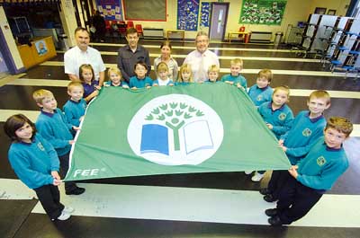 Pictured are pupils from Golden Grove’s Eco Club with the school’s third Eco Schools Green Flag. They are pictured with Clr. Huw George, teacher Rhian Bruce, headteacher Leslie Johnson and caretaker Jason Robinson. The pupils are Rhys Griffiths, Mair Tyrie, Toby Bowen, Ben Omnet, Holly Castell, Elleigh Terry, Ioan Lewis, Eirian Edwards, Jake Fransham, Anna Strudwick, Thomas Robinson, Charlie Marsh, Nuala Camplin, and Milley Dearden.
