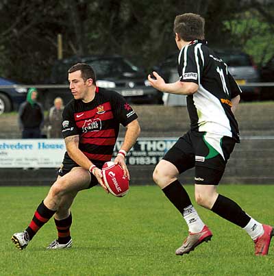 Jimmy Davies in possession. Jimmy scored all United’s points with three penalties.