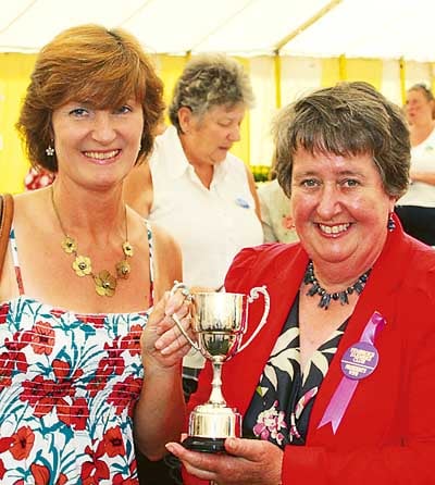 Kathleen John, president’s wife, presents Jill McKarren with her award for cookery and preserves.