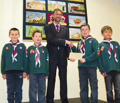 From left, Cubs Max Badham, Henry Lees, Thomas Lees and Jay Rees are pictured with Rotarian Andy Tulley, president of the Rotary Club of Tenby.