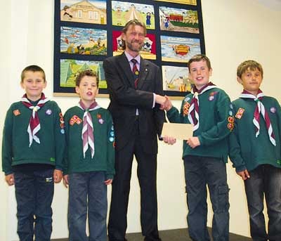 From left, Cubs Max Badham, Henry Lees, Thomas Lees and Jay Rees are pictured with Rotarian Andy Tulley, president of the Rotary Club of Tenby.