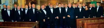 Tenby Male Choir with Mrs. Shirley Wheeler, vice-president, Pembroke Ladies Lifeboat Guild, and Rev. Roger Jones, vicar of St. Mary’s, Pembroke.