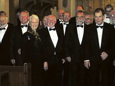 Mrs. Shirley Wheeler with Tom Pearce, Tenby choir founder member, and Terry Evans, chairman.