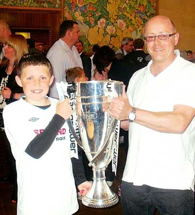 Thomas and Ian with the championship play-off final trophy.