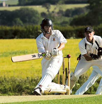 Top-scorer for Carew, Ian Sefton, hits out to add to his total of 52 against Neyland. Pic. Susan McKehon