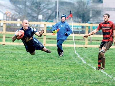 Airbourne scrum-half Adrian Killa enjoys his score in the corner.