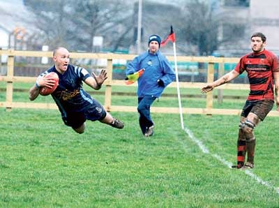 Airbourne scrum-half Adrian Killa enjoys his score in the corner.