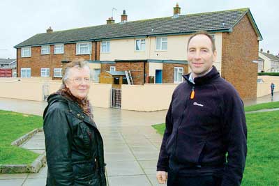 Pictured are Clr. Jamie Adams and local Clr. Pearl Llewellyn outside some of the properties in Monkton which have recently benefited from improvement works.