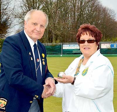 President of Pembroke Dock Bowling Club, Mr. Graham Bann, presenting the silver jack to Mrs. Jackie Church, West Wales Ladies Bowling Association president.