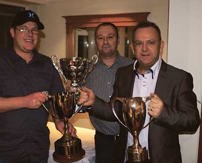 Leigh Rogers with his array of cups