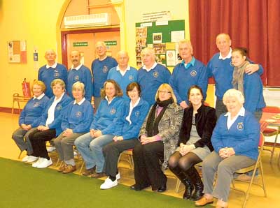 Club members with the people who donated, chair of Llanion Communities First, Sue Perkins, front row, third from right, and South Hook LNG community liaison co-ordinator, Laura Allen-Clarke, front row, second from right.