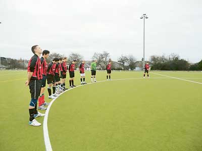 A minute’s silence is observed by the players in memory of Nic Webster-Smith before the start of last week’s memorial match.