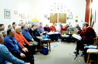 Members of the choir rehearsing at the County Club.