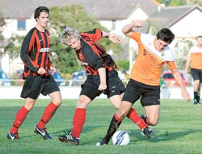 Alex Harley and Ryan Howells tussle for the ball as Curtis Hurlow looks on.