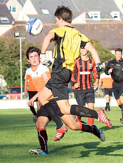 Corey Hill charges from his area to thwart an attack by Ryan Howells