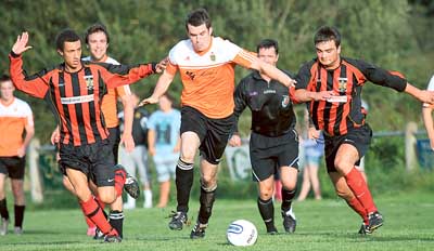 Daryl Mansbridge and Callum Proctor fail to halt Nick Cope in Tuesday night’s local derby clash between Tenby and Saundersfoot at The Clicketts, which the visitors went on to win 3-0.