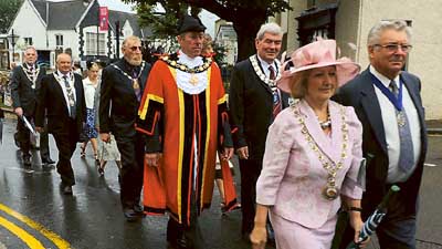 Pembrokeshire County Council chairman, Clr. Mrs. Anne Hughes, along with her consort, Mr. Jim Hughes, stepping out on the civic parade. Pic. Malcolm Richards Photography