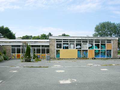 Windows boarded up at Narberth’s old primary school, which MP Nick Ainger claims will become an eyesore for visitors to the town. Observer pic.