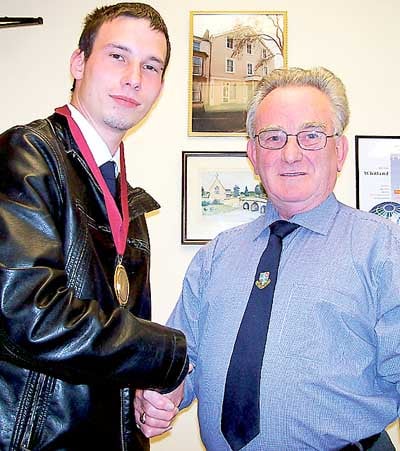 Clr. Craig Wilson, Whitland’s Deputy Mayor (seen left) is congratulated by outgoing Deputy Mayor, Clr. Ron Jenkins MBE.