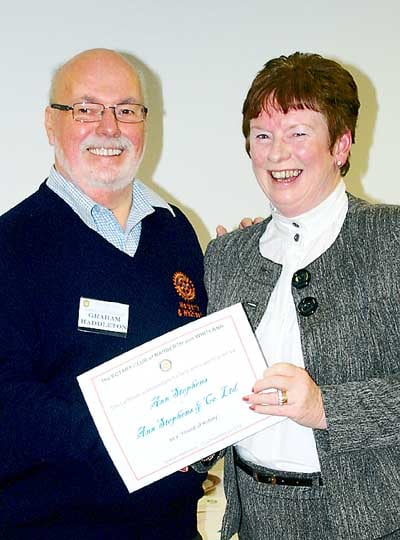 President Graham Haddleton presenting a certificate of thanks to Ann Stevens, an accountant who has helped the club.