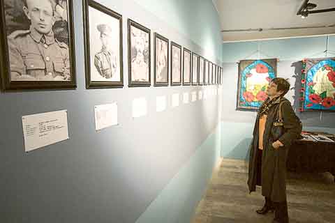 A visitor viewing photographs in the ‘Letters from the Front’ exhibition.
