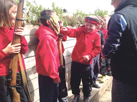 Having fun trying on gas masks and using rifles on the ‘fire step’.