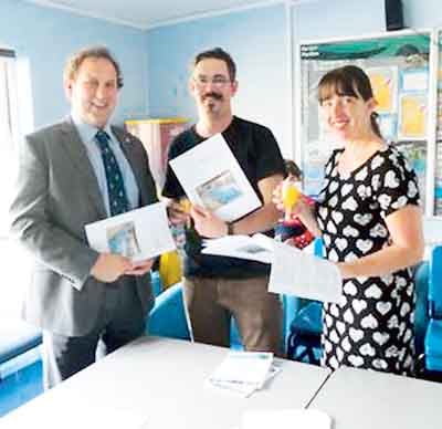 Clr. Elwyn Morse, Ben Furgusson-Walker and Kelly Harrison with the new share offer document.