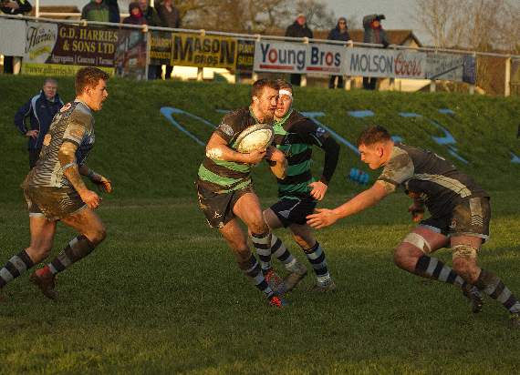 Ianto Griffiths evading opposition with Jake Jenkins in support.