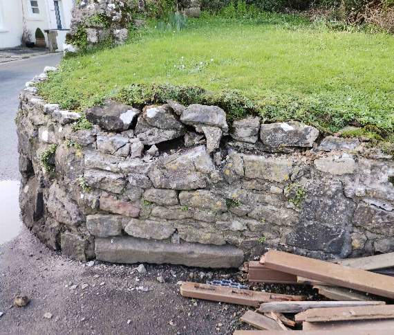 The lorry also caused damage to a wall...