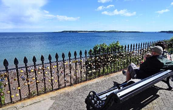 A spot on Tenby's Esplanade looking out to Caldey proved popular for those wishing to mark their visit to the town (Pic. Gareth Davies Photography)
