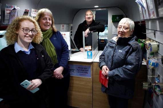 Customers in Templeton with the Post Office van driver.
