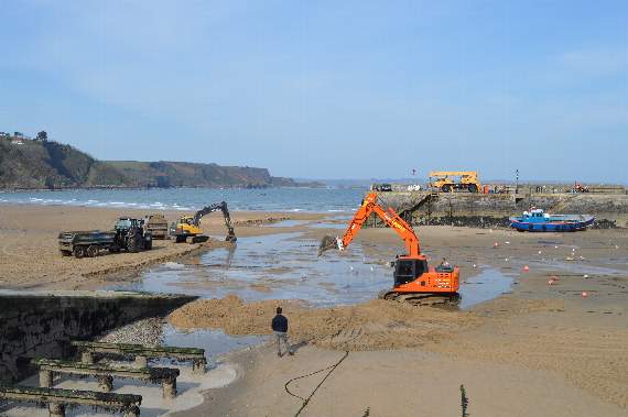 Tenby harbourmaster Chris Salisbury is pictured on Monday overseeing the dredging operation of the harbour area and North Beach. (Observer pic)